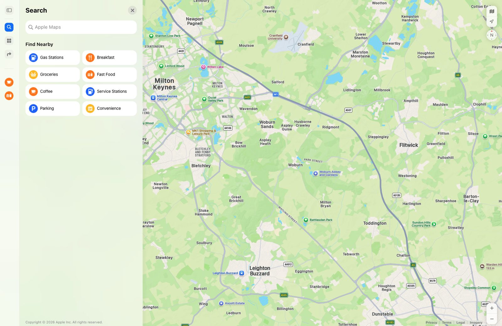 Apple Maps in a browser: a Search panel on the left with Find Nearby tiles, the map of Milton Keynes and Bedfordshire beside it